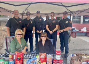 2026 Food Drive at the Merc with Council Members Marlys, Sheryl and Timberlake firefighters